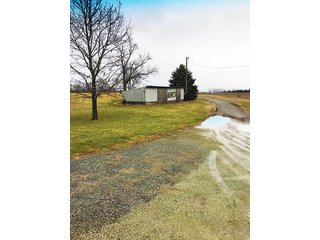 6 Acres with mobile home, 54' x 88' heated and insulated pole building with office, equipment storage, shop, overhead storage and restroom.  Well and 2 septic systems.  24' x 40' livestock or storage building.

Great for mini-farm or additional storage and shop for local farmers.  Excellent potential building site. - 6 Acres with Mobile Home, Pole Building & Storage or Livestock Building